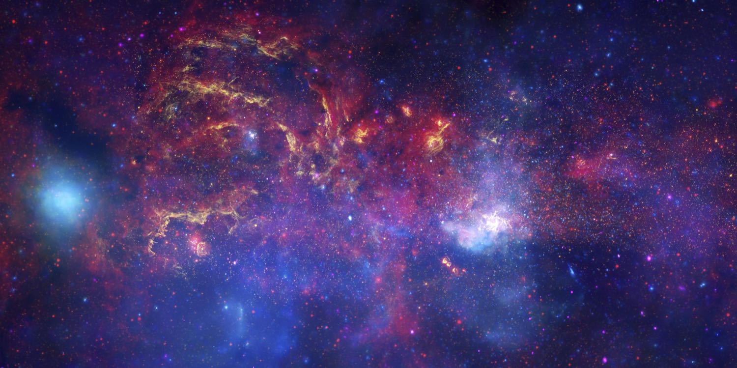 The glowing, crowded middle of the Milky Way, in reds, golds and blues